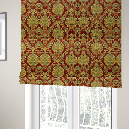The fabric used to create these Roman blinds is a  ornate damask fabric featuring large, symmetrical floral medallions in shades of sage green, golden ochre, and muted orange.