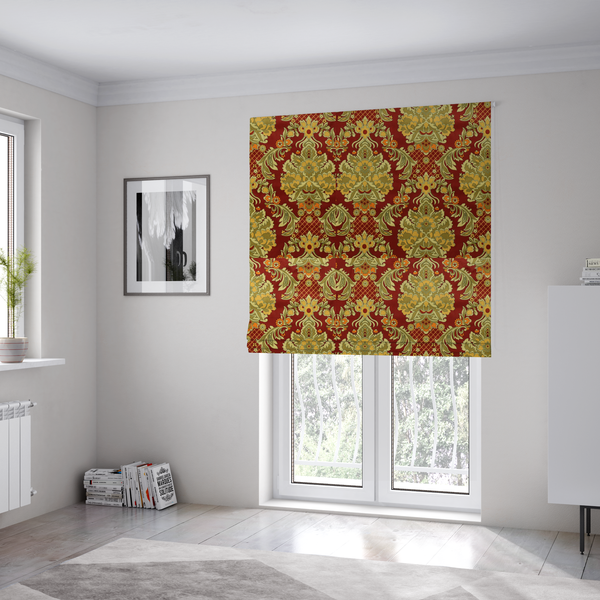 The fabric used to create these Roman blinds is a  ornate damask fabric featuring large, symmetrical floral medallions in shades of sage green, golden ochre, and muted orange.