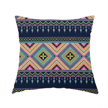 The fabric used to create this handmade cushion is a vibrant, repeating geometric Aztec or tribal fabric pattern organized in horizontal bands. The design features alternating wide stripes of colourful diamond and zigzag motifs against narrower dark navy bands filled with intricate chevron and tassel-like embroidery accents.