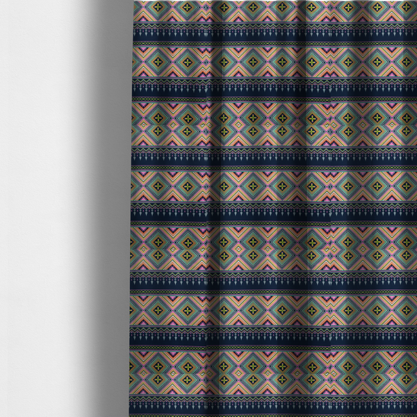 The fabric used to create these made-to-measure curtains is a vibrant, repeating geometric Aztec or tribal fabric pattern organized in horizontal bands. The design features alternating wide stripes of colourful diamond and zigzag motifs against narrower dark navy bands filled with intricate chevron and tassel-like embroidery accents.
