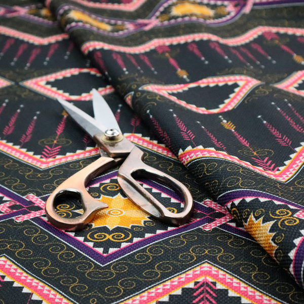 An intricate, repeating tribal fabric pattern set against a dark charcoal-black background, featuring horizontal bands of detailed geometric, ikat, and ornate line art motifs.