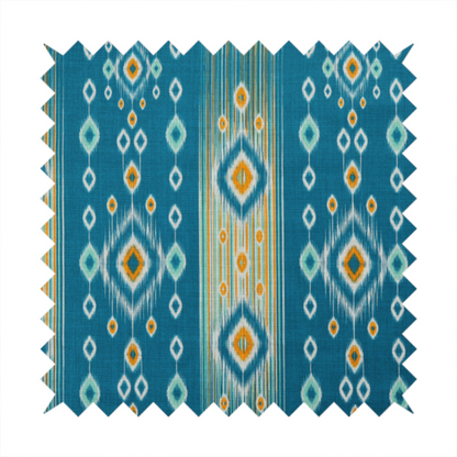A seamless, vertically striped ikat fabric pattern with traditional blurred or feathered edges set against a rich teal backdrop.