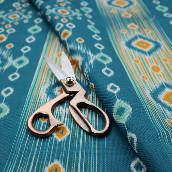 A seamless, vertically striped ikat fabric pattern with traditional blurred or feathered edges set against a rich teal backdrop.