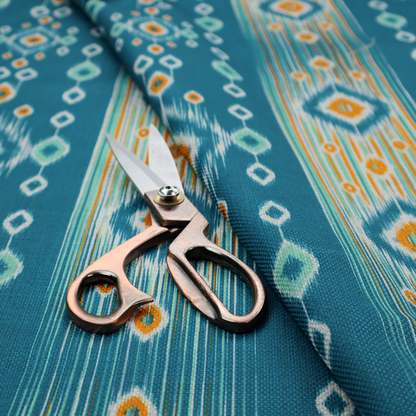 A seamless, vertically striped ikat fabric pattern with traditional blurred or feathered edges set against a rich teal backdrop.