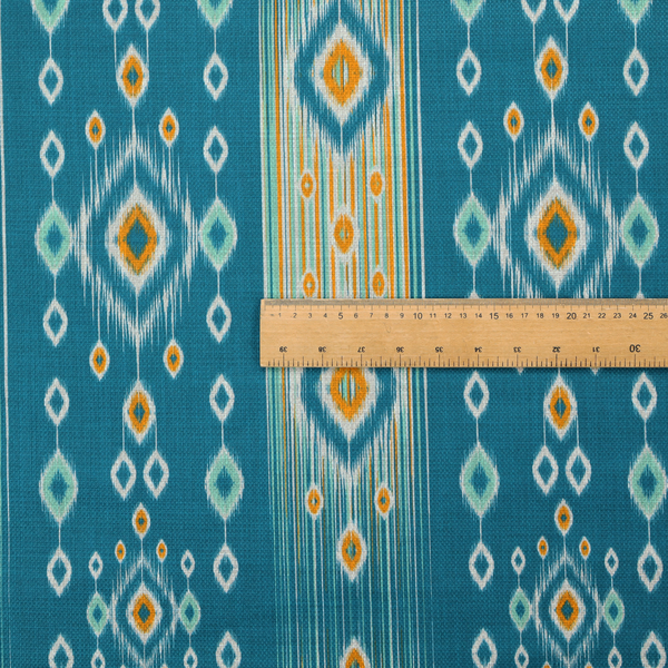A seamless, vertically striped ikat fabric pattern with traditional blurred or feathered edges set against a rich teal backdrop.