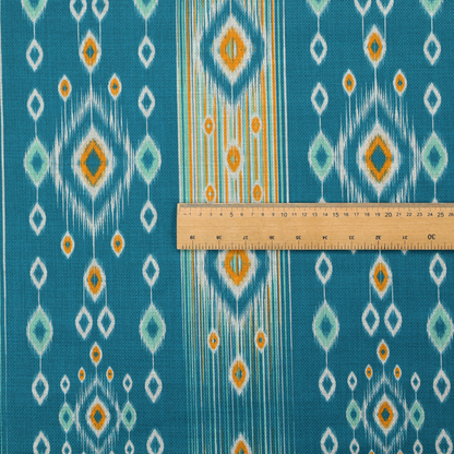 A seamless, vertically striped ikat fabric pattern with traditional blurred or feathered edges set against a rich teal backdrop.