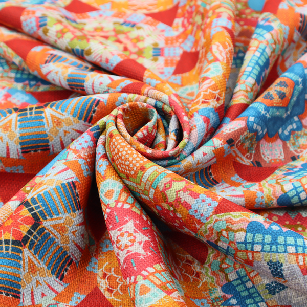 A vibrant, kaleidoscope-inspired fabric pattern composed of interlocking circular and octagonal medallions set against a rich, fiery red-orange background.