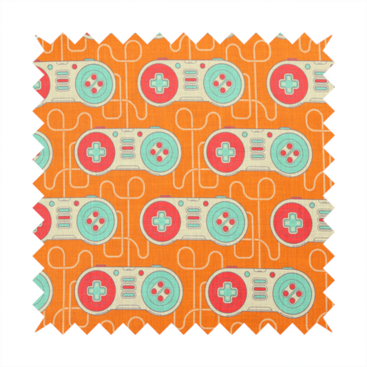 A playful, retro-inspired repeating fabric pattern featuring classic video game controllers connected by winding cord lines set against a warm orange background.