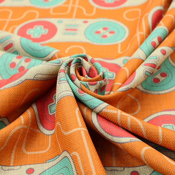 A playful, retro-inspired repeating fabric pattern featuring classic video game controllers connected by winding cord lines set against a warm orange background.