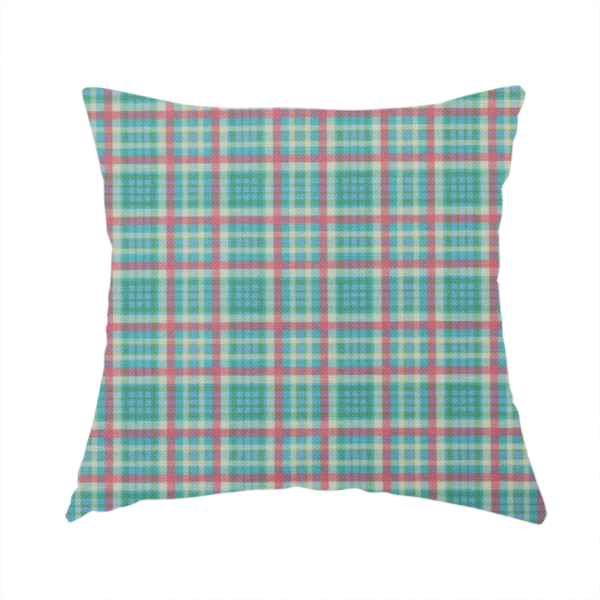 The fabric used to create this handmade cushion is a fabric features a woven plaid pattern consisting of intersecting horizontal and vertical stripes in shades of teal, soft pink, light blue, and cream. The pattern creates a series of repeated squares and rectangles across the surface.