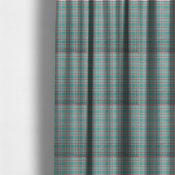 The fabric used to create these made-to-measure curtains is a fabric features a woven plaid pattern consisting of intersecting horizontal and vertical stripes in shades of teal, soft pink, light blue, and cream. The pattern creates a series of repeated squares and rectangles across the surface.