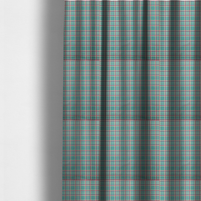 The fabric used to create these made-to-measure curtains is a fabric features a woven plaid pattern consisting of intersecting horizontal and vertical stripes in shades of teal, soft pink, light blue, and cream. The pattern creates a series of repeated squares and rectangles across the surface.