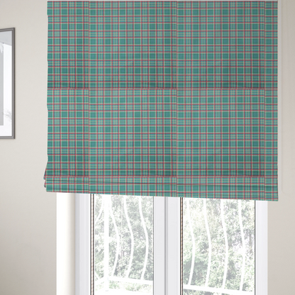 The fabric used to create these Roman blinds is a fabric features a woven plaid pattern consisting of intersecting horizontal and vertical stripes in shades of teal, soft pink, light blue, and cream. The pattern creates a series of repeated squares and rectangles across the surface.