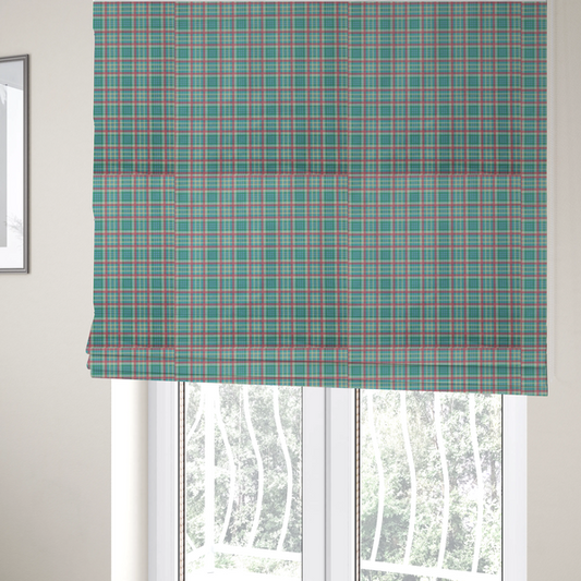 The fabric used to create these Roman blinds is a fabric features a woven plaid pattern consisting of intersecting horizontal and vertical stripes in shades of teal, soft pink, light blue, and cream. The pattern creates a series of repeated squares and rectangles across the surface.