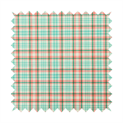 This fabric features a woven plaid pattern with a grid of intersecting horizontal and vertical stripes in coral, aqua, and dark green over a cream-colored background.
