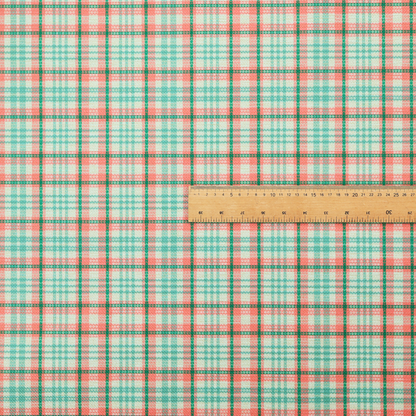 This fabric features a woven plaid pattern with a grid of intersecting horizontal and vertical stripes in coral, aqua, and dark green over a cream-colored background.
