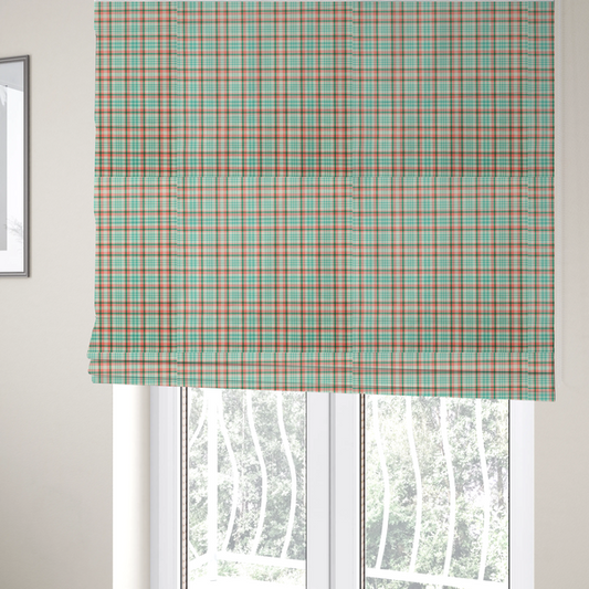 The fabric used to create these Roman blinds is a fabric features a woven plaid pattern with a grid of intersecting horizontal and vertical stripes in coral, aqua, and dark green over a cream-colored background.