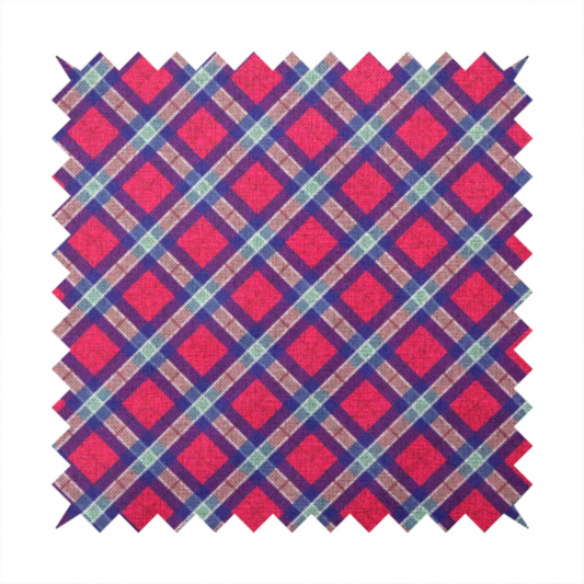 This fabric features a diagonal plaid pattern, creating a diamond-shaped grid. The design is composed of bold magenta squares framed by dark blue and thin white intersecting lines.