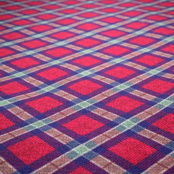 This fabric features a diagonal plaid pattern, creating a diamond-shaped grid. The design is composed of bold magenta squares framed by dark blue and thin white intersecting lines.