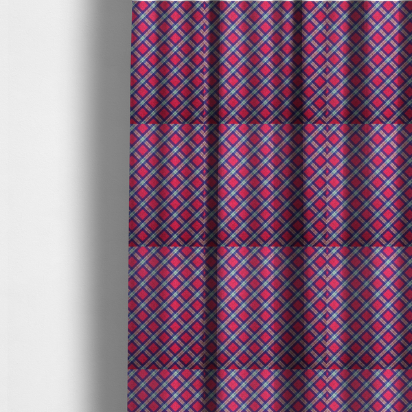 The fabric used to create these made-to-measure curtains is a fabric features a diagonal plaid pattern, creating a diamond-shaped grid. The design is composed of bold magenta squares framed by dark blue and thin white intersecting lines.