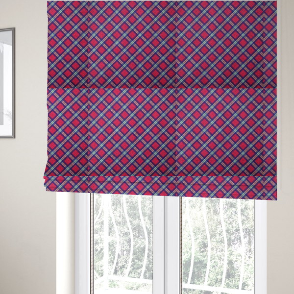 The fabric used to create these Roman blinds is a fabric features a diagonal plaid pattern, creating a diamond-shaped grid. The design is composed of bold magenta squares framed by dark blue and thin white intersecting lines.
