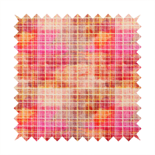 This fabric features an intricate, layered plaid pattern that blends warm tones of red, orange, yellow, and deep pink. The design has a slightly blurred, watercolour effect with a dense grid of fine white and gold lines overlapping the vibrant colours.