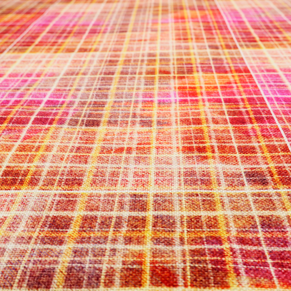 This fabric features an intricate, layered plaid pattern that blends warm tones of red, orange, yellow, and deep pink. The design has a slightly blurred, watercolour effect with a dense grid of fine white and gold lines overlapping the vibrant colours.