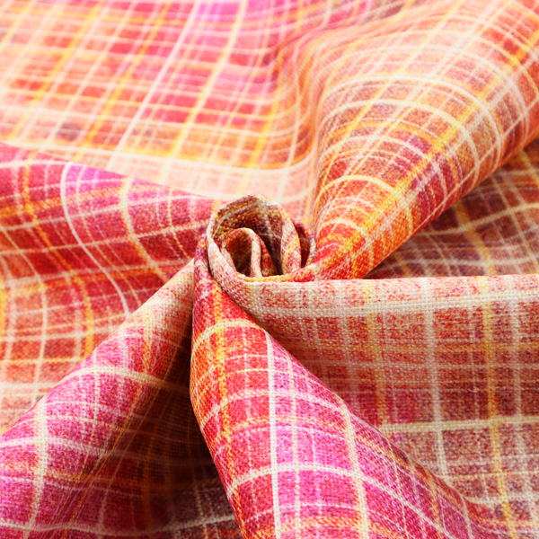 This fabric features an intricate, layered plaid pattern that blends warm tones of red, orange, yellow, and deep pink. The design has a slightly blurred, watercolour effect with a dense grid of fine white and gold lines overlapping the vibrant colours.