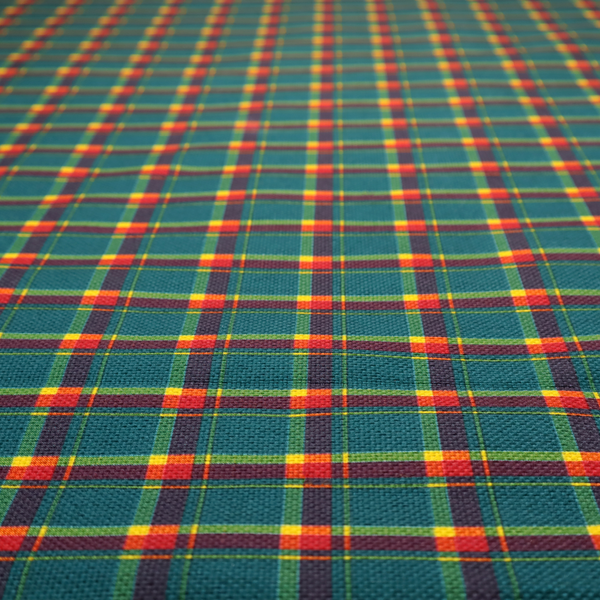 This fabric features a woven plaid pattern dominated by a deep teal background, intersected by a structured grid of thin horizontal and vertical lines in bright yellow, orange, and dark burgundy.