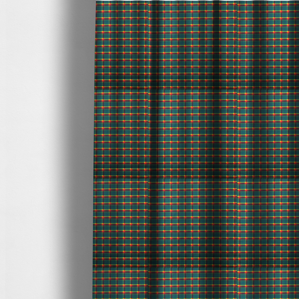 The fabric used to create these made-to-measure curtains is a fabric features a woven plaid pattern dominated by a deep teal background, intersected by a structured grid of thin horizontal and vertical lines in bright yellow, orange, and dark burgundy.