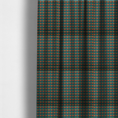 The fabric used to create these made-to-measure curtains is a fabric features a woven plaid pattern dominated by a deep teal background, intersected by a structured grid of thin horizontal and vertical lines in bright yellow, orange, and dark burgundy.