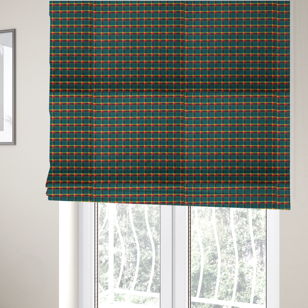 The fabric used to create these Roman blinds is a fabric features a woven plaid pattern dominated by a deep teal background, intersected by a structured grid of thin horizontal and vertical lines in bright yellow, orange, and dark burgundy.