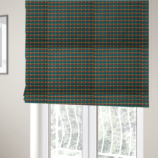 The fabric used to create these Roman blinds is a fabric features a woven plaid pattern dominated by a deep teal background, intersected by a structured grid of thin horizontal and vertical lines in bright yellow, orange, and dark burgundy.