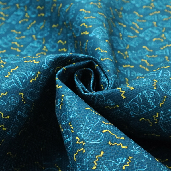 This fabric features a playful, dark teal background covered in a whimsical pattern of small, light blue line-art monsters and yellow zigzagging lightning bolt accents.