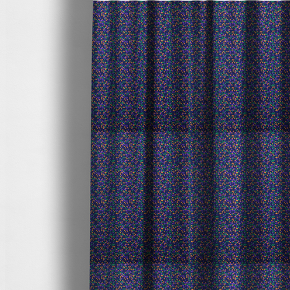 The fabric used to create these made-to-measure curtains is a fabric features a dense geometric pattern of tiny, randomly oriented triangles in shades of purple, green, and orange scattered across a solid dark navy blue background.