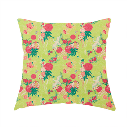 The fabric used to create this handmade cushion is a fabric features a whimsical, Chinoiseries-inspired pattern on a bright chartreuse-green background, repeating illustrations of white cranes, large dark pink pom-pom flowers, and leafy green ferns.