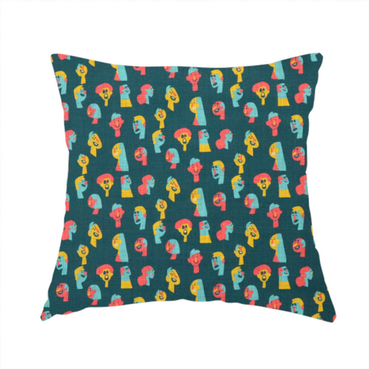 The fabric used to create this handmade cushion is a fabric features a whimsical, repeating pattern on a dark teal background, decorated with stylized, colourful illustrations of diverse human faces in shades of bright yellow, light blue, and coral pink.