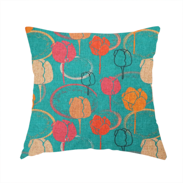 The fabric used to create this handmade cushion is a fabric features a retro-inspired floral pattern on a bright teal background, with repeating motifs of stylized tulips in shades of orange, coral, and beige, interspersed with thin black line-art outlines of tulips and layered circular elements.