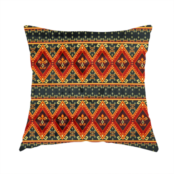 The fabric used to create this handmade cushion is a fabric print featuring a repeating Southwestern geometric pattern. The design consists of horizontal bands with large red, orange, and yellow diamond motifs mixed with thin charcoal black borders detailed with small, delicate yellow tribal symbols.