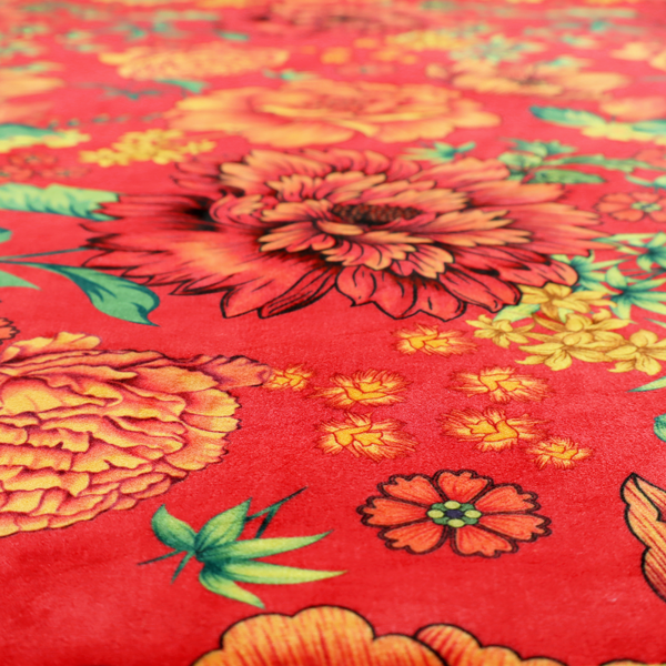 A vibrant red fabric featuring a repeating Chinoiseries floral pattern with large, detailed peony and marigold blossoms in shades of orange and yellow, accented by green leaves and stems.