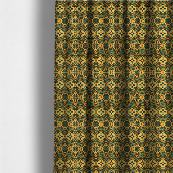 The fabric used to create these made-to-measure curtains is a print featuring a repeating retro ikat ogee pattern. The geometric design displays a lattice of mustard yellow onion arches, green leaf shapes, and four-leaf clover medallions outlined in fuzzy black brushstrokes with pops of coral orange.