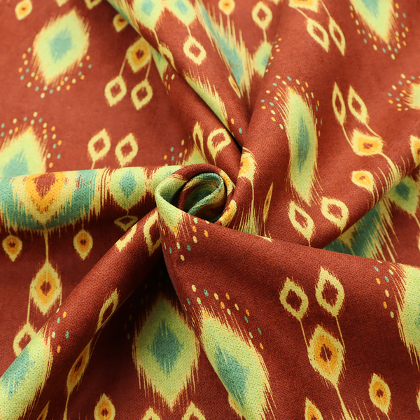 Fabric print featuring a repeating vertical ikat pattern. The design showcases distinct diamond and teardrop motifs with feathered edges in soft sage green, teal, and mustard yellow over a solid terracotta red background.