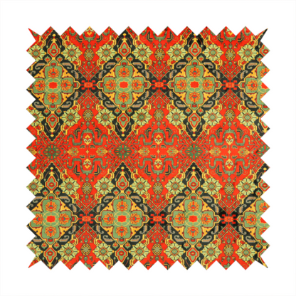 Fabric print featuring an intricate, repeating Persian rug or Moroccan mosaic design. The pattern displays large geometric medallions and scrolling damask shapes in vibrant red, jade green, and warm gold.
