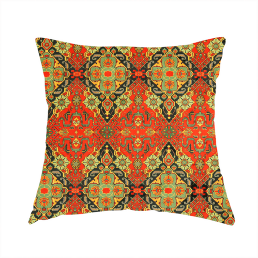 The fabric used to create this handmade cushion is a print featuring an intricate, repeating Persian rug or Moroccan mosaic design. The pattern displays large geometric medallions and scrolling damask shapes in vibrant red, jade green, and warm gold.
