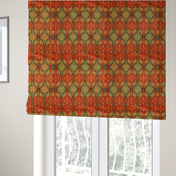 The fabric used to create these Roman blinds is a print featuring an intricate, repeating Persian rug or Moroccan mosaic design. The pattern displays large geometric medallions and scrolling damask shapes in vibrant red, jade green, and warm gold.