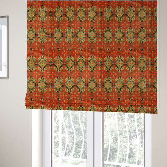 The fabric used to create these Roman blinds is a print featuring an intricate, repeating Persian rug or Moroccan mosaic design. The pattern displays large geometric medallions and scrolling damask shapes in vibrant red, jade green, and warm gold.