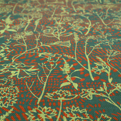 Fabric print featuring a whimsical wildflower meadow pattern. The design showcases delicate lime-green line art sketches of slender stems and blossoms over a deep teal-green background layered with small, textured terracotta orange dashes.