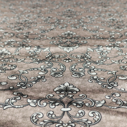 Fabric featuring a repeating traditional damask pattern in white and dark grey outlines over a textured, light taupe background.