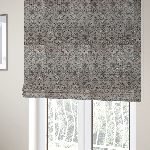 The fabric used to create these Roman blinds is featuring a repeating traditional damask pattern in white and dark grey outlines over a textured, light taupe background.