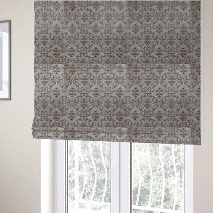 The fabric used to create these Roman blinds is featuring a repeating traditional damask pattern in white and dark grey outlines over a textured, light taupe background.